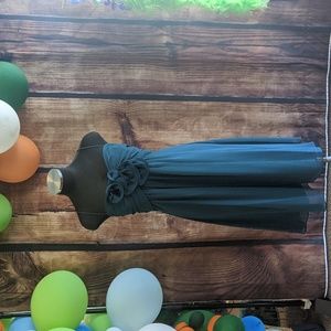 This dark turquoise dress from DFI is a size 2XL but fits the same as an 18.